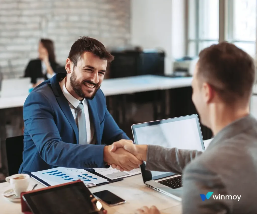 Winmoy LLC partners shaking hands to confirm a strategic digital growth plan for a US-based firm