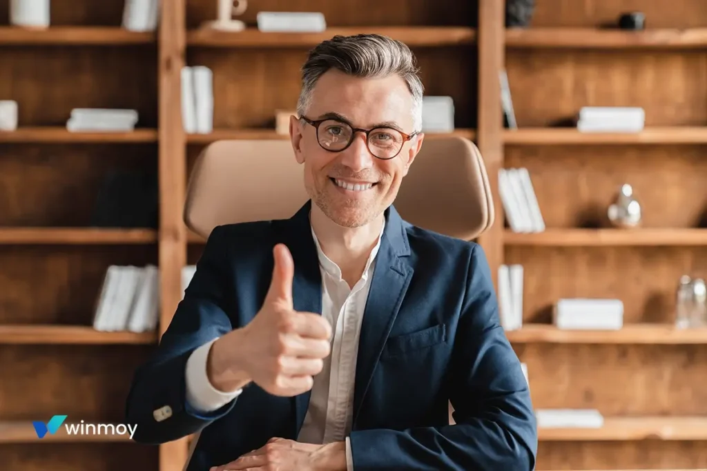A professional client giving a thumbs-up after achieving success through the Winmoy LLC strategic growth roadmap.